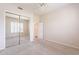 Bright bedroom featuring soft carpet and mirrored closet doors at 9113 N 116Th Way, Scottsdale, AZ 85259