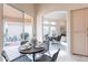 Dining area with seating for four and an exterior view at 9113 N 116Th Way, Scottsdale, AZ 85259