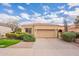 Charming single-story home featuring a tile roof, a two-car garage, and meticulous landscaping at 9113 N 116Th Way, Scottsdale, AZ 85259