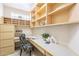 Cozy home office featuring custom shelving and a functional workspace at 9113 N 116Th Way, Scottsdale, AZ 85259