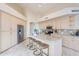 A spacious kitchen featuring a center island with bar seating and stainless steel appliances at 9113 N 116Th Way, Scottsdale, AZ 85259