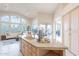 Bright kitchen with an island and breakfast bar, complemented by a spacious living area at 9113 N 116Th Way, Scottsdale, AZ 85259