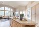 Bright kitchen with granite counters, stainless steel appliances, and ample cabinet space at 9113 N 116Th Way, Scottsdale, AZ 85259