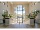 Well-lit lobby with palm views at 9113 N 116Th Way, Scottsdale, AZ 85259