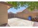 Relaxing backyard with stone ground cover, block wall, and lots of trees at 9116 W Acoma Dr, Peoria, AZ 85381