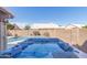 Inviting backyard features a sparkling blue hot tub and refreshing swimming pool at 9116 W Acoma Dr, Peoria, AZ 85381