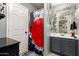 Functional bathroom featuring a vanity with storage and a shower/tub combo with a musical theme at 11234 W Roma Ave, Phoenix, AZ 85037