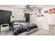 This modern bedroom features a stylish bed frame, decorative lighting, and music-themed decor at 11234 W Roma Ave, Phoenix, AZ 85037