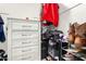 Walk-in closet with built-in shelving and organization system at 11234 W Roma Ave, Phoenix, AZ 85037