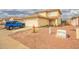 Two-story home features a two car garage, low maintenance landscaping, and covered front porch at 11234 W Roma Ave, Phoenix, AZ 85037