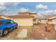 Charming exterior elevation featuring a two-car garage and low-maintenance landscaping at 11234 W Roma Ave, Phoenix, AZ 85037