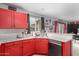 This updated kitchen features modern appliances, granite countertops, and ample cabinet space at 11234 W Roma Ave, Phoenix, AZ 85037