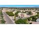 Wide aerial view of the property highlighting its well-maintained exteriors, ample parking, and proximity to community amenities at 13035 N 34Th St # 7, Phoenix, AZ 85032