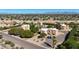Expansive aerial view showcasing a well-manicured property, surrounded by lush landscaping, and scenic mountain views in the distance at 13035 N 34Th St # 7, Phoenix, AZ 85032