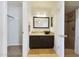 The well-lit bathroom has a bowl sink and tiled floor at 13035 N 34Th St # 7, Phoenix, AZ 85032