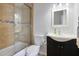 This is a bathroom with a modern vanity and tiled shower at 13035 N 34Th St # 7, Phoenix, AZ 85032