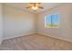 The bedroom is carpeted and well-lit with a ceiling fan at 13035 N 34Th St # 7, Phoenix, AZ 85032