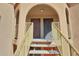 Arched entryway with painted staircase leading to the front doors, offering a secure entrance at 13035 N 34Th St # 7, Phoenix, AZ 85032
