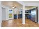 Open concept kitchen with granite countertops, stainless steel appliances, and French door to balcony at 13035 N 34Th St # 7, Phoenix, AZ 85032
