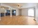 Bright, open floor plan with tile floors, ceiling fans, kitchen access, and natural light at 13035 N 34Th St # 7, Phoenix, AZ 85032