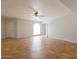 Bright open living space with tile floors, ceiling fan, and arched doorways to other rooms at 13035 N 34Th St # 7, Phoenix, AZ 85032