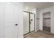 Contemporary bathroom with a sleek, frameless glass shower and easy access to the walk-in closet at 15610 S 181St Dr, Goodyear, AZ 85338
