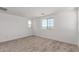 This sun-filled bedroom features soft carpeting and multiple windows for lots of natural light at 15610 S 181St Dr, Goodyear, AZ 85338