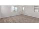 Bright bedroom with neutral carpet and paint, offering a blank canvas for personalization at 15610 S 181St Dr, Goodyear, AZ 85338