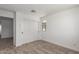 Bedroom featuring sliding door closet, neutral carpet, white walls and one window for natural light at 15610 S 181St Dr, Goodyear, AZ 85338