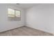 Bedroom featuring neutral walls and plush carpeting and view of backyard at 15610 S 181St Dr, Goodyear, AZ 85338