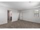 Bedroom showcasing plush carpeting and neutral walls, plus easy access to bathroom at 15610 S 181St Dr, Goodyear, AZ 85338
