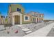 The two-story home has a charming facade with clean landscaping and neutral tones, set in a well-planned neighborhood at 15610 S 181St Dr, Goodyear, AZ 85338