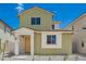 A well-kept two-story home is showcased with white trim and clean landscaping against a bright blue sky at 15610 S 181St Dr, Goodyear, AZ 85338