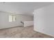 Bright living room featuring neutral carpet, white walls and one window for natural light at 15610 S 181St Dr, Goodyear, AZ 85338