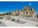 The neighborhood street features various architectural styles, low-water landscaping, and well-maintained sidewalks at 15610 S 181St Dr, Goodyear, AZ 85338