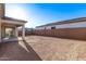 View of large backyard and stucco wall, perfect for outdoor entertaining and recreation at 15846 W Bronco Trl, Surprise, AZ 85387