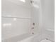 Bright bathroom features a shower over tub with white subway tile and modern fixtures at 15846 W Bronco Trl, Surprise, AZ 85387