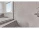 Close up of walk-in shower, tub with grey tiling, and modern fixtures at 15846 W Bronco Trl, Surprise, AZ 85387