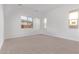 Bright bedroom with carpet flooring and windows allowing natural light at 15846 W Bronco Trl, Surprise, AZ 85387