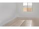 Bedroom features tile flooring and a bright window providing natural light at 15846 W Bronco Trl, Surprise, AZ 85387