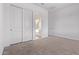 Bedroom with ensuite bathroom and large sliding door closet at 15846 W Bronco Trl, Surprise, AZ 85387