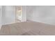 Spacious bedroom featuring plush carpet and ensuite bathroom at 15846 W Bronco Trl, Surprise, AZ 85387