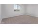 Bright bedroom with plush carpet flooring and plenty of natural light at 15846 W Bronco Trl, Surprise, AZ 85387