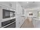 Modern kitchen with stainless steel appliances, white subway tile backsplash, and a large center island at 15846 W Bronco Trl, Surprise, AZ 85387