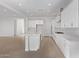 Spacious open-concept kitchen with a large island and seamless flow to the living area at 15846 W Bronco Trl, Surprise, AZ 85387