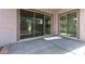 Covered patio features large sliding glass doors with backyard views at 15846 W Bronco Trl, Surprise, AZ 85387