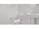 Clean and modern powder room with a pedestal sink and white toilet at 15846 W Bronco Trl, Surprise, AZ 85387