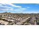 Expansive aerial view of a residential neighborhood with mountain views and clear blue skies, showcasing community charm at 16424 N 1St Dr, Phoenix, AZ 85023