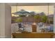 Cozy backyard seating area with a fire pit and shaded by an umbrella, perfect for outdoor relaxation at 16424 N 1St Dr, Phoenix, AZ 85023