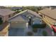 Charming single-Gathering home boasts well-manicured landscaping, a two-car garage and an inviting entrance at 16424 N 1St Dr, Phoenix, AZ 85023